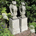 Hand carved garden ornament statue lion on plinths sculpture